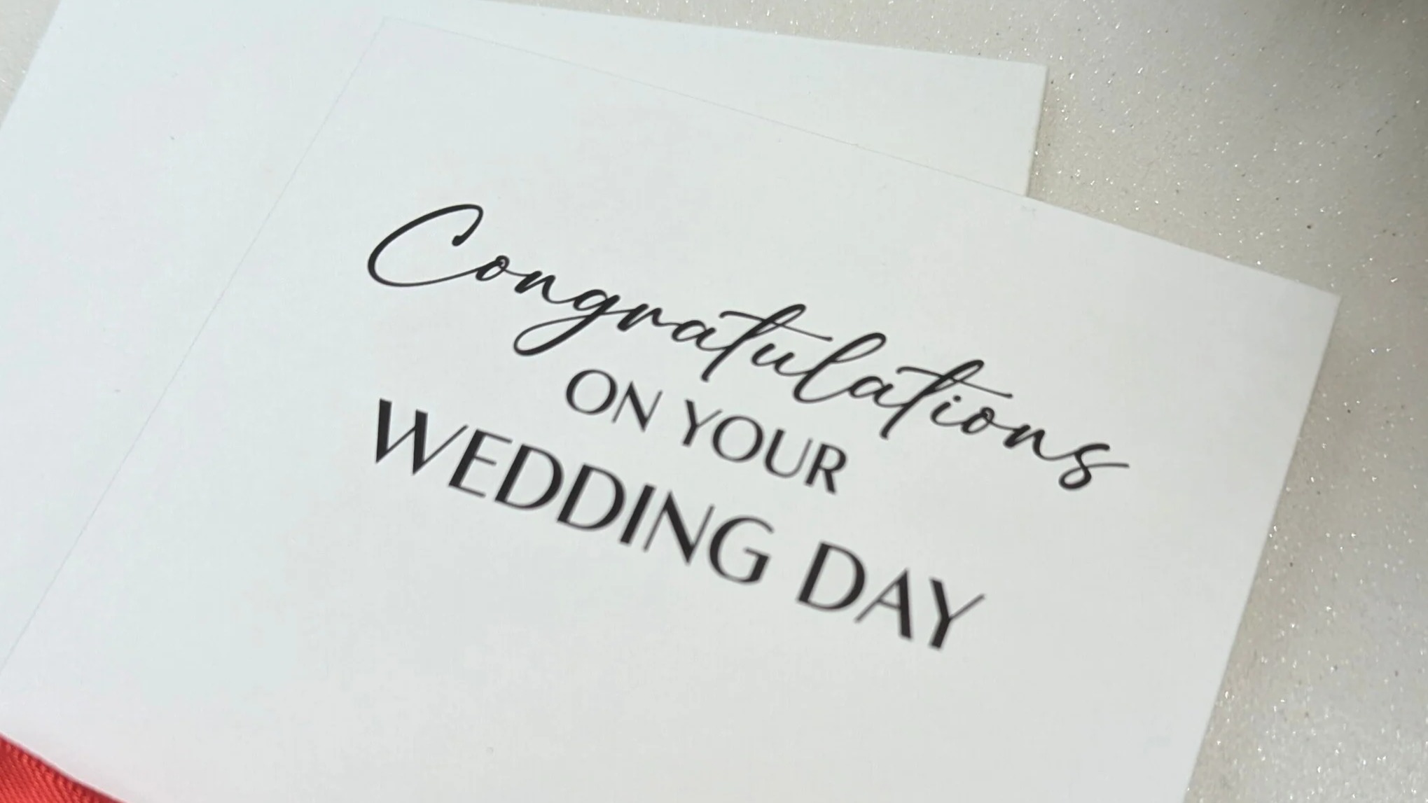 Chinese_Red_Wedding_card_close_up.webp