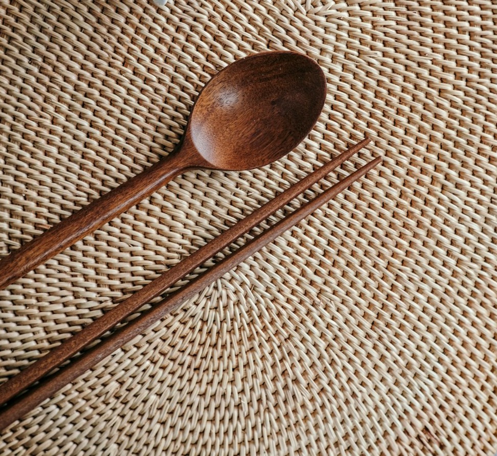 brown wooden spoon on brown and white textile