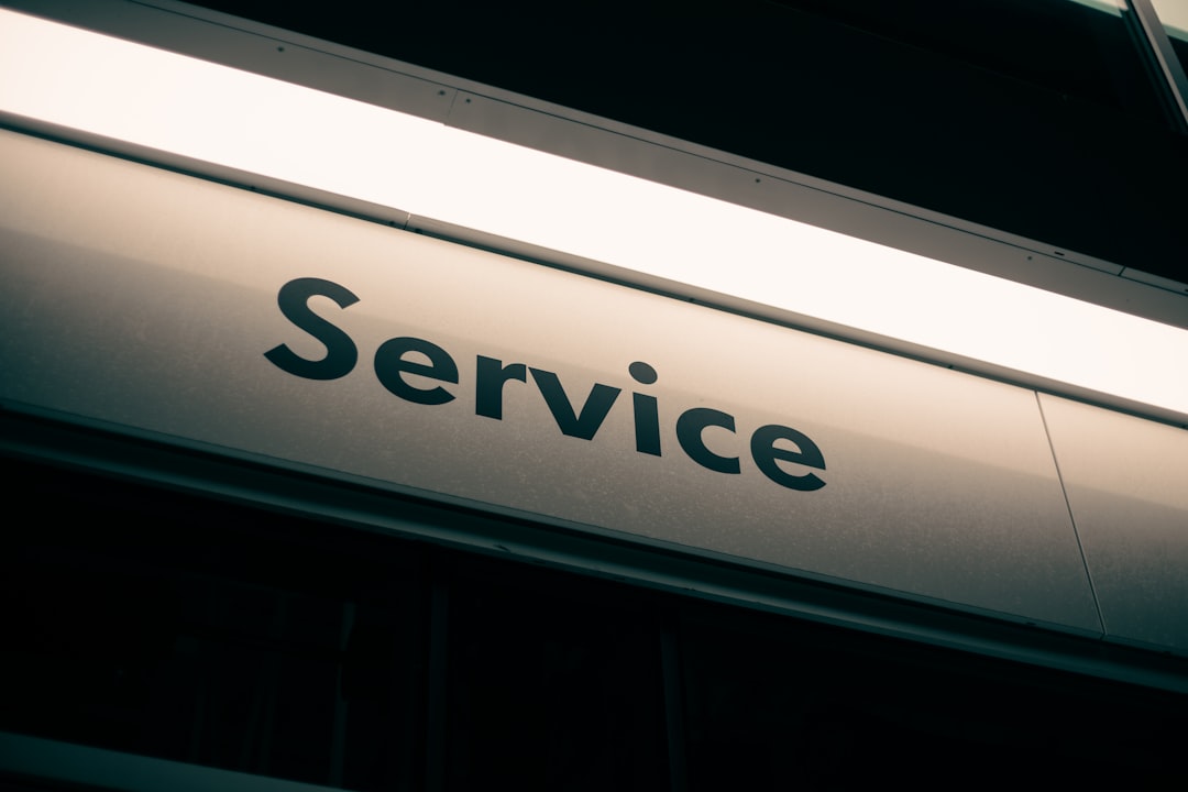 A sign with the word Service in black letters on a white background