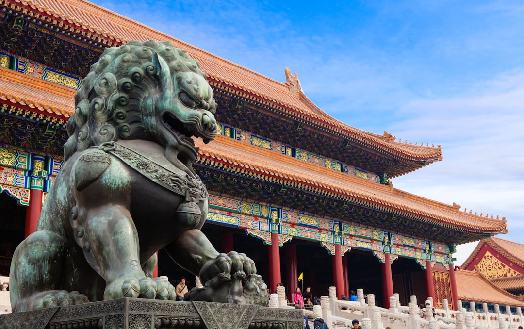 A bronze guardian lion statue before the Hall of Supreme Harmony in Beijing, China