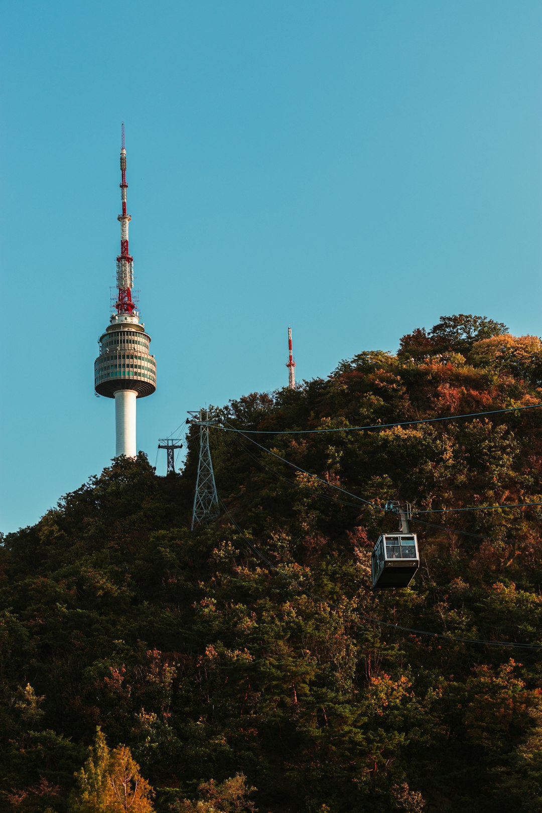 white and red tower under blue sky during daytime