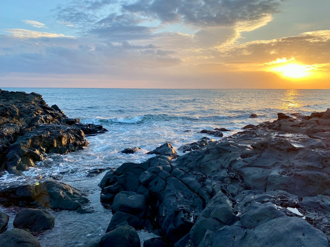 a rocky beach with waves crashing